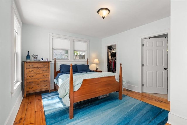 4 Arlington St Unit A, Newburyport, MA 01950 - bedroom featuring wood-type flooring, multiple windows, and baseboards