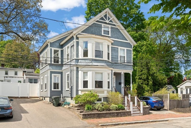 4 Arlington St Unit A, Newburyport, MA 01950 - victorian-style house featuring fence and driveway