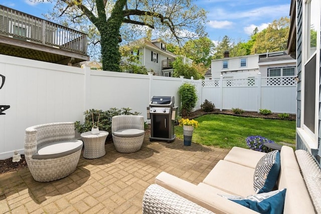 4 Arlington St Unit A, Newburyport, MA 01950 - view of patio / terrace with grilling area, a fenced backyard, and an outdoor living space
