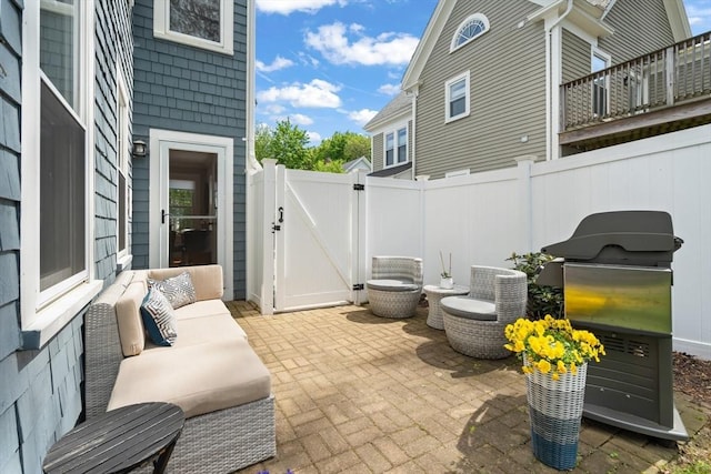4 Arlington St Unit A, Newburyport, MA 01950 - view of patio with a gate, fence, and an outdoor living space