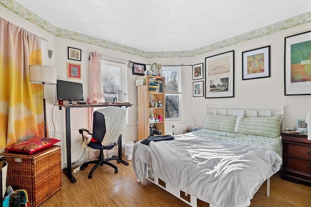 bedroom featuring wood finished floors