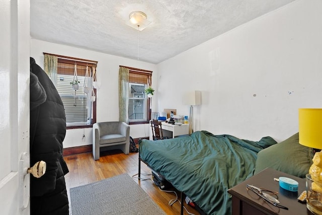 bedroom featuring wood finished floors