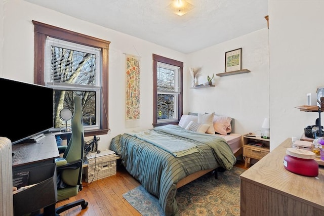 bedroom with wood-type flooring