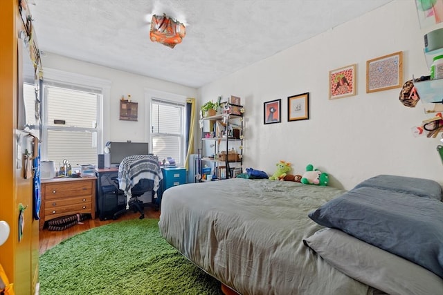 bedroom with wood finished floors