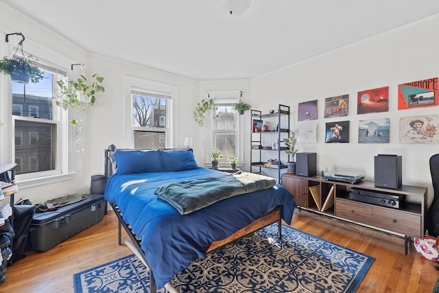 bedroom with wood finished floors