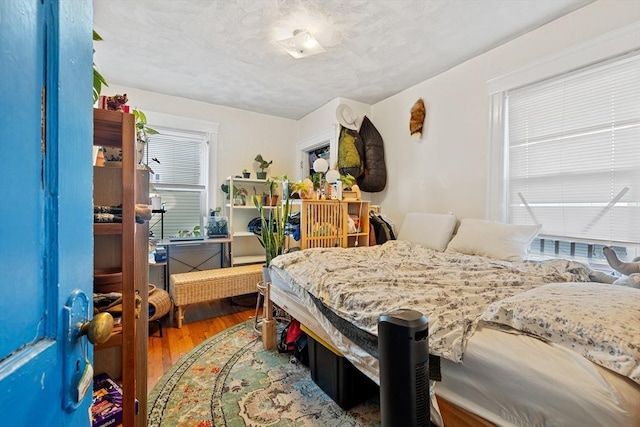 bedroom with wood finished floors