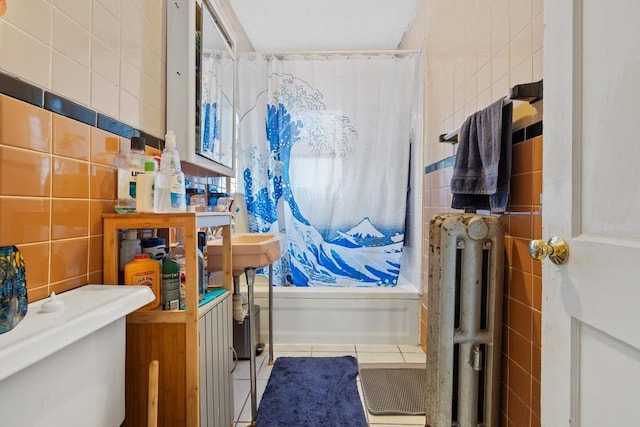 full bathroom featuring shower / bath combination with curtain, tile walls, toilet, and tile patterned floors