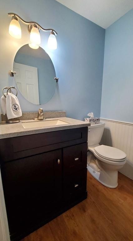 728 Auburn St Unit F8, Whitman, MA 02382 - bathroom with wood finished floors, vanity, and wainscoting