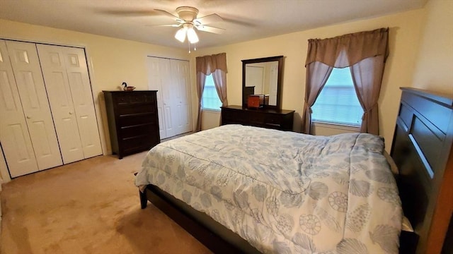 728 Auburn St Unit F8, Whitman, MA 02382 - bedroom featuring two closets, light carpet, and a ceiling fan