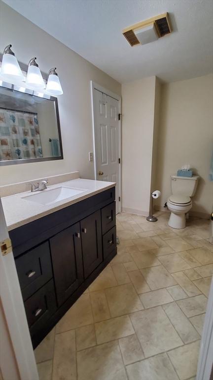 728 Auburn St Unit F8, Whitman, MA 02382 - full bathroom featuring vanity and a shower with curtain