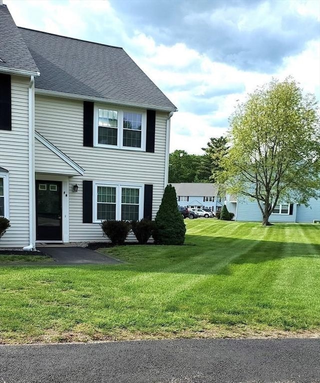 728 Auburn St Unit F8, Whitman, MA 02382 - view of front of property with a front yard, a patio area, and roof with shingles