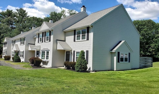 728 Auburn St Unit F8, Whitman, MA 02382 - view of front of house featuring a chimney, a front yard, and a shingled roof