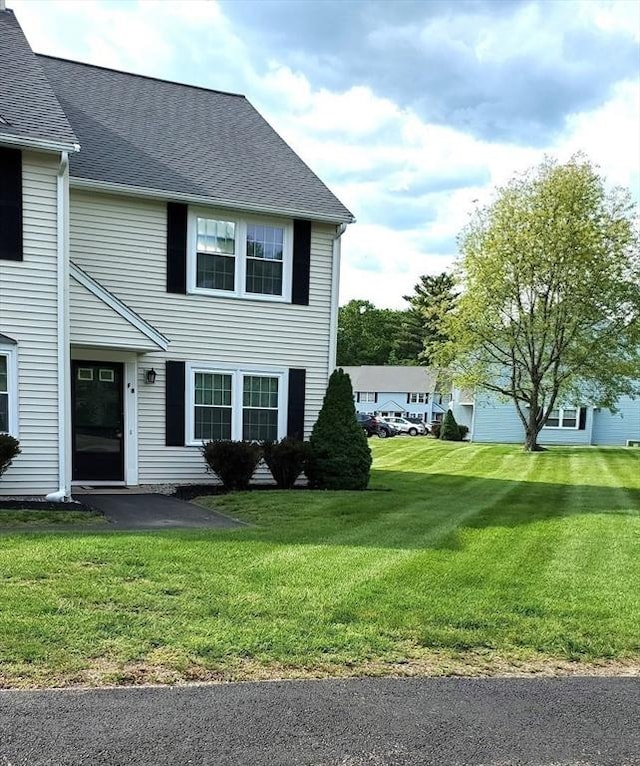 728 Auburn St Unit F8, Whitman, MA 02382 - view of front of home with a front yard, a patio, and roof with shingles