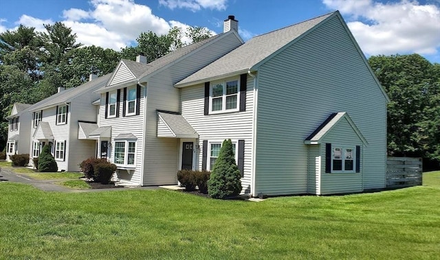 728 Auburn St Unit F8, Whitman, MA 02382 - view of front of home with a chimney, a front yard, and a shingled roof