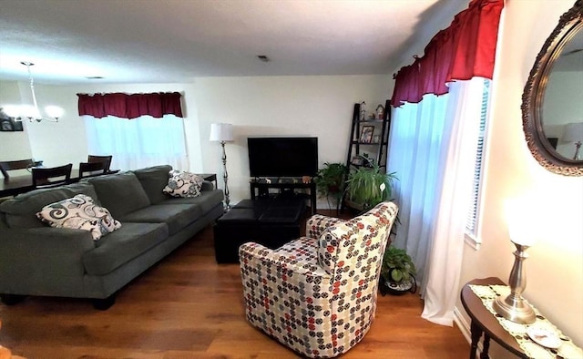 728 Auburn St Unit F8, Whitman, MA 02382 - living area featuring wood finished floors and a chandelier