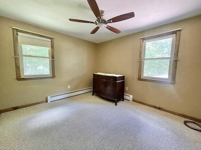 2 Bushy Ln, Rutland, MA 01543 - unfurnished bedroom featuring a baseboard heating unit, multiple windows, and carpet floors