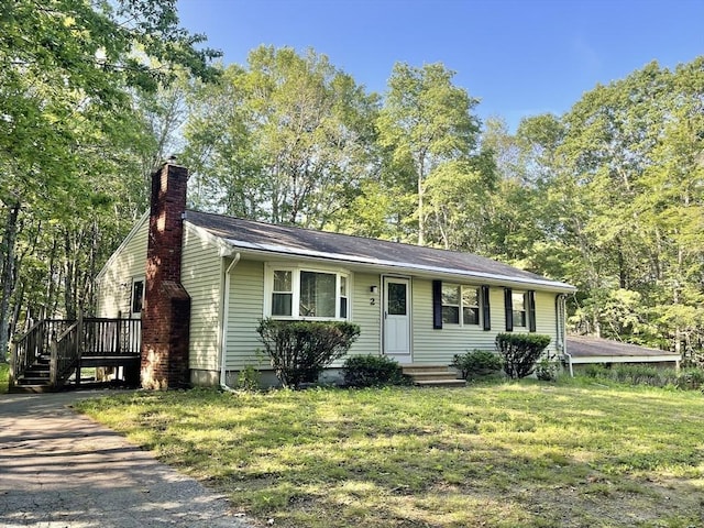 2 Bushy Ln, Rutland, MA 01543 - view of front facade featuring a chimney, a front lawn, and a wooden deck