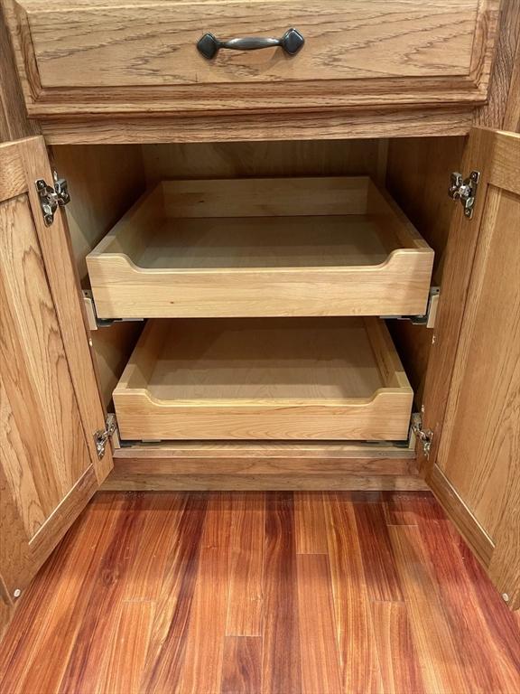 2 Bushy Ln, Rutland, MA 01543 - detailed view of wood finished floors and brown cabinets
