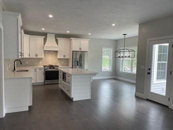 288 Fisher Rd, Holden, MA 01520 - kitchen with appliances with stainless steel finishes, custom range hood, light countertops, dark wood-style flooring, and recessed lighting