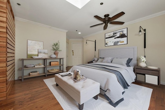 bedroom with hardwood / wood-style flooring, recessed lighting, baseboards, ornamental molding, and a skylight
