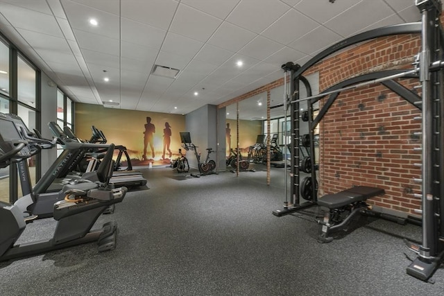 gym featuring brick wall