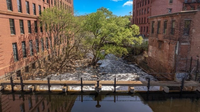 view of property exterior featuring a water view