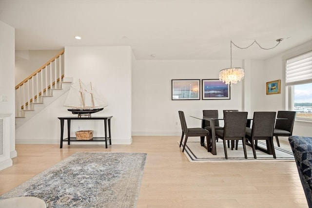 266 Merrimac St Unit F, Newburyport, MA 01950 - dining space featuring stairway, a chandelier, wood finished floors, recessed lighting, and baseboards