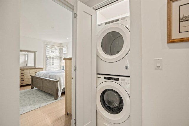 266 Merrimac St Unit F, Newburyport, MA 01950 - laundry room with estacked washer and dryer and wood finished floors