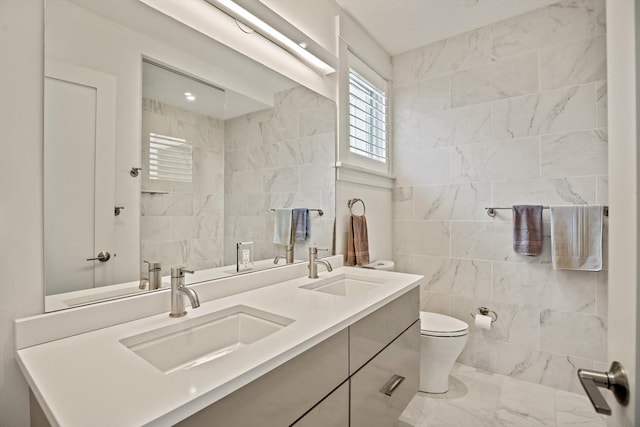 266 Merrimac St Unit F, Newburyport, MA 01950 - full bath featuring tile walls, marble finish flooring, toilet, and double vanity