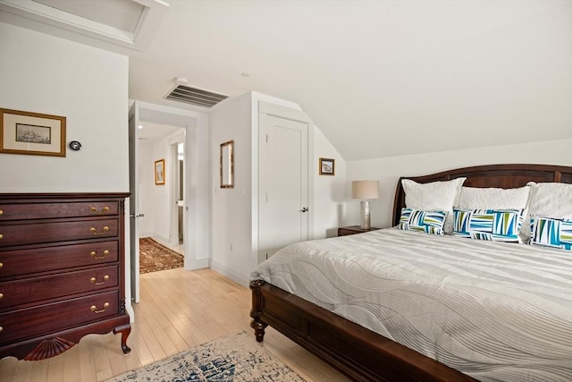 266 Merrimac St Unit F, Newburyport, MA 01950 - bedroom featuring light wood-style flooring, lofted ceiling, and attic access