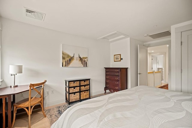 266 Merrimac St Unit F, Newburyport, MA 01950 - bedroom with wood finished floors, attic access, and baseboards