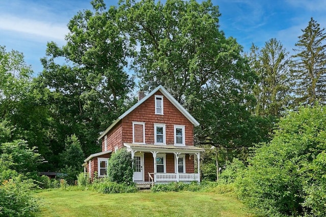 115 S Shelburne Rd, Greenfield, MA 01301 - view of front of house featuring covered porch, a front yard, and a chimney