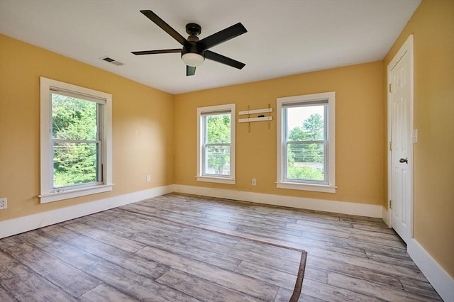 115 S Shelburne Rd, Greenfield, MA 01301 - empty room with plenty of natural light, wood finished floors, and a ceiling fan