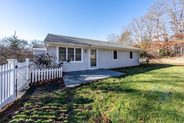 rear view of property with a patio area and a lawn