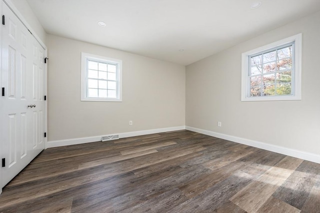 unfurnished bedroom with dark hardwood / wood-style floors