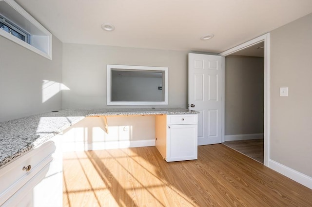 bathroom with hardwood / wood-style floors