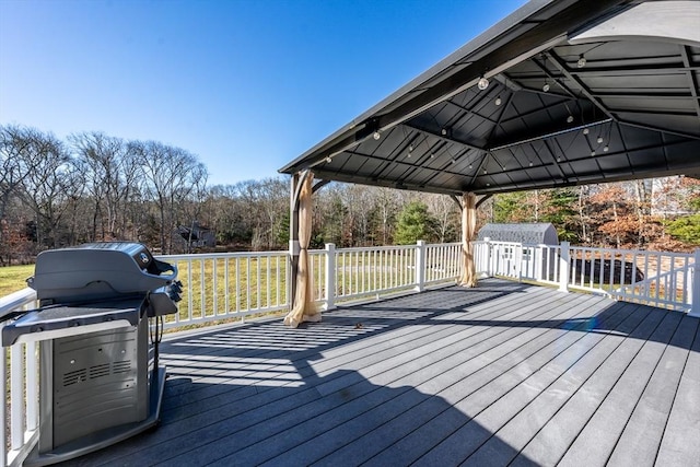 wooden terrace featuring area for grilling