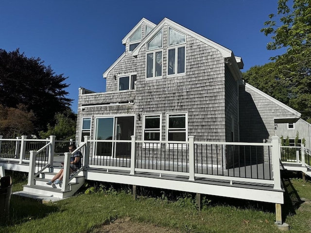 back of property with a wooden deck