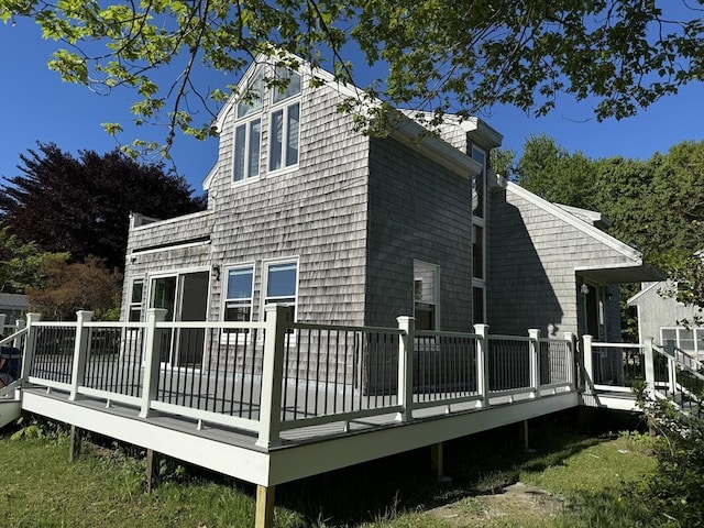 back of house featuring a deck