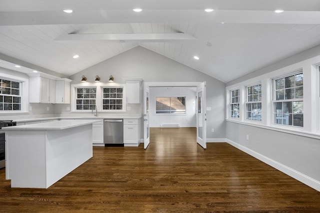 kitchen featuring dishwasher, light countertops, white cabinets, and vaulted ceiling with beams