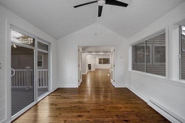 hall featuring a baseboard radiator, lofted ceiling, a healthy amount of sunlight, and wood finished floors