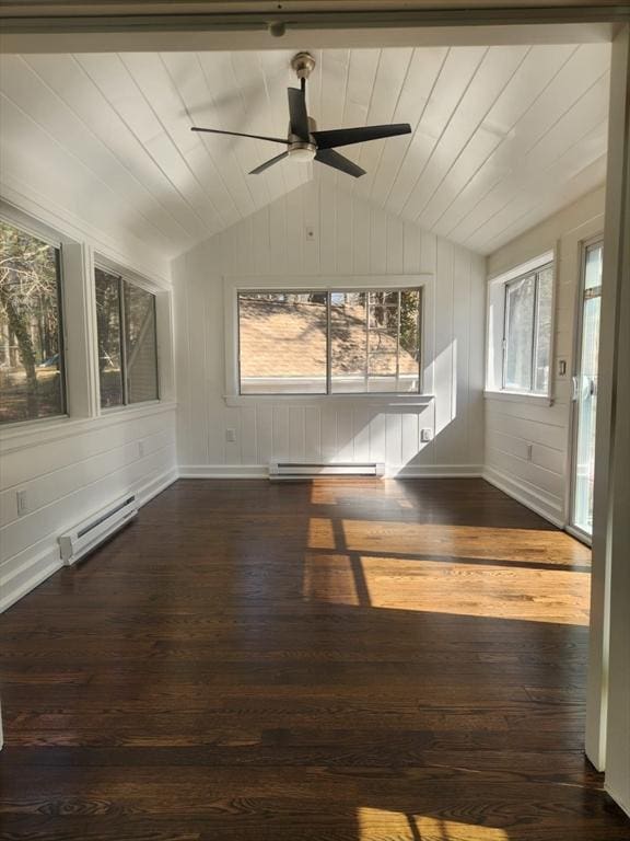 interior space with dark wood-style floors, ceiling fan, vaulted ceiling, a baseboard heating unit, and baseboard heating