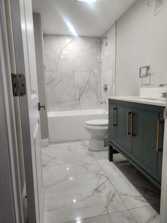 full bath featuring washtub / shower combination, toilet, marble finish floor, and vanity