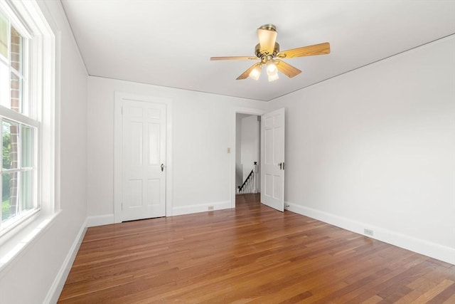 unfurnished bedroom with baseboards, light wood-style floors, and ceiling fan