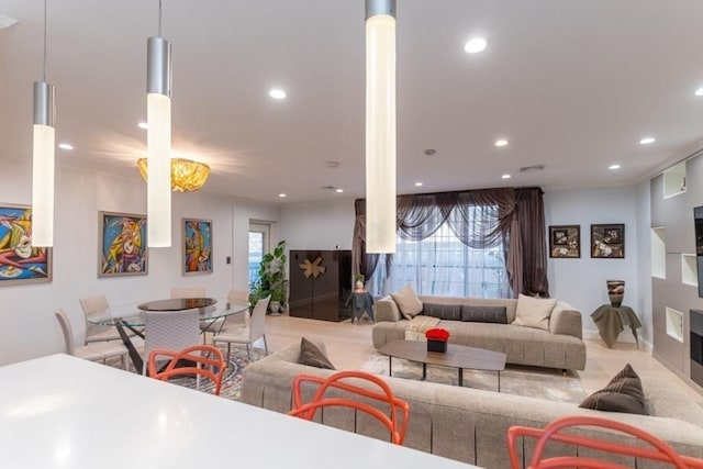 living room with plenty of natural light, recessed lighting, and visible vents