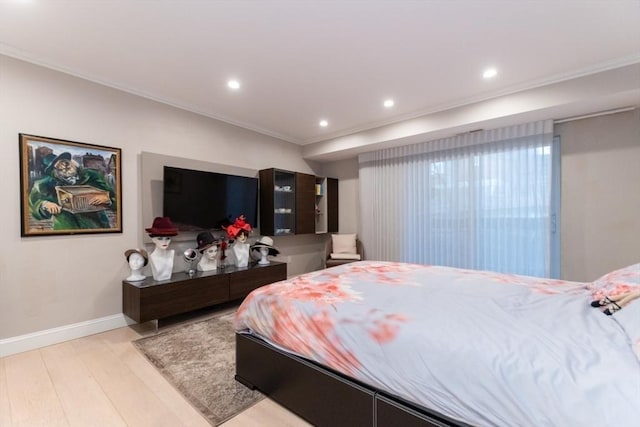 bedroom featuring recessed lighting, light wood-type flooring, baseboards, and ornamental molding