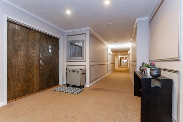 hall featuring light carpet and ornamental molding