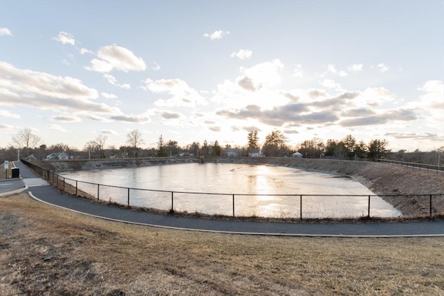 view of water feature with fence