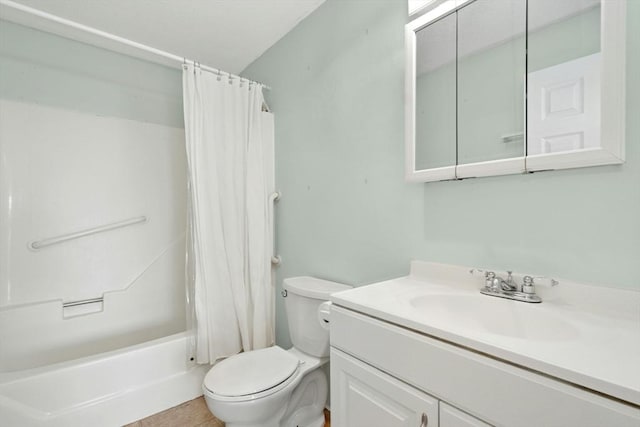 full bath with tile patterned floors, vanity, toilet, and shower / bath combo with shower curtain