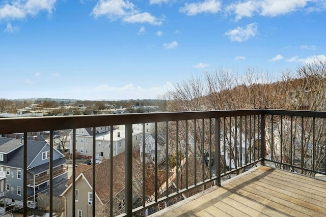 wooden deck featuring a residential view